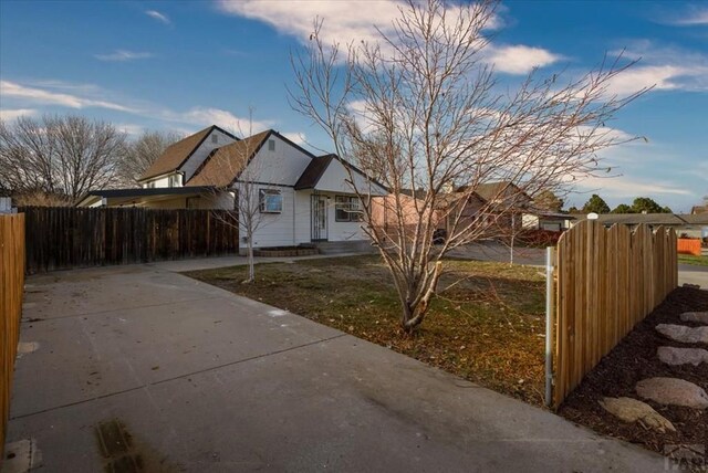 view of property exterior featuring a fenced front yard