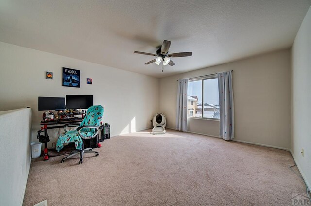 office space featuring carpet and ceiling fan