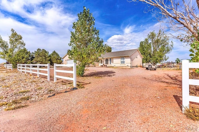 view of front of house with fence