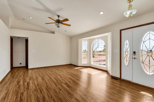 entrance foyer with lofted ceiling, baseboards, wood finished floors, and recessed lighting