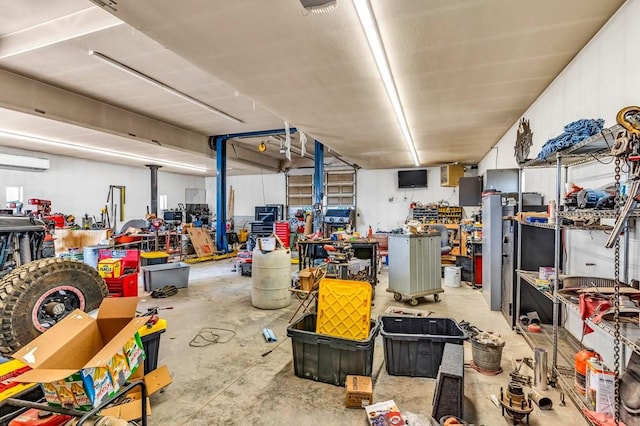 interior space with an AC wall unit and a workshop area