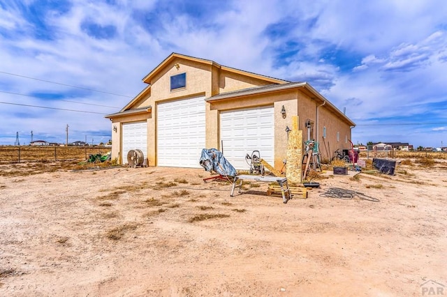 detached garage with fence