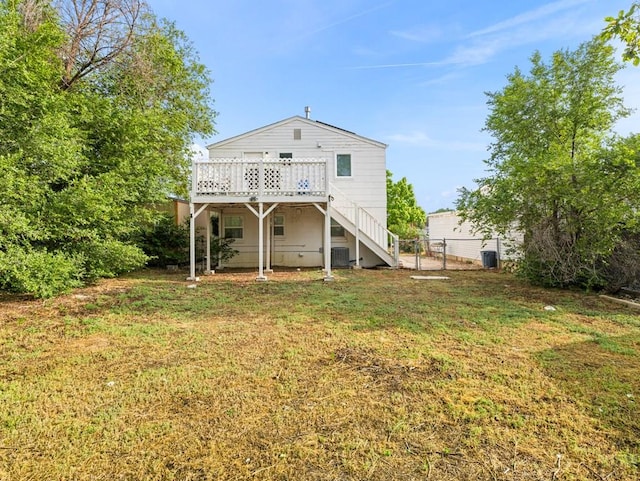 2202 W 15th St, Pueblo, CO 81003 - back of property featuring stairs and a wooden deck