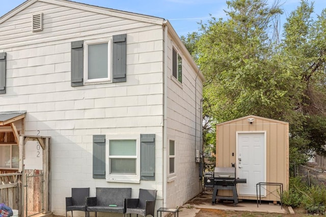 2202 W 15th St, Pueblo, CO 81003 - back of house featuring a storage shed and a patio
