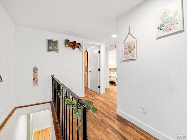 2202 W 15th St, Pueblo, CO 81003 - corridor with an upstairs landing and wood finished floors