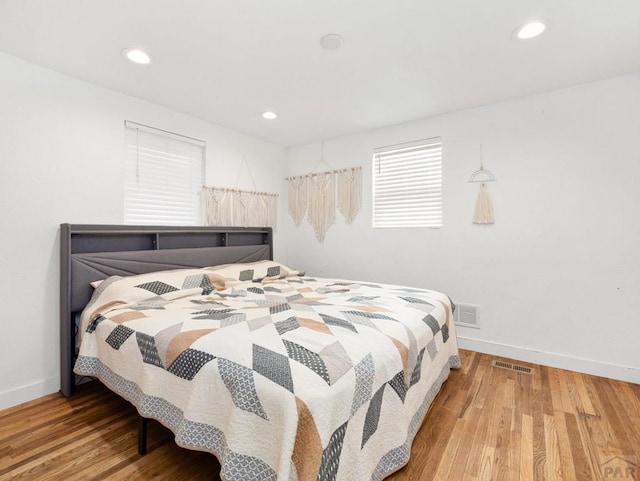 2202 W 15th St, Pueblo, CO 81003 - bedroom with wood finished floors and recessed lighting
