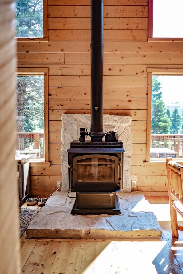 317 Parsons Rd, La Veta, CO 81055 - detailed view of wood walls, a wood stove, and wood finished floors