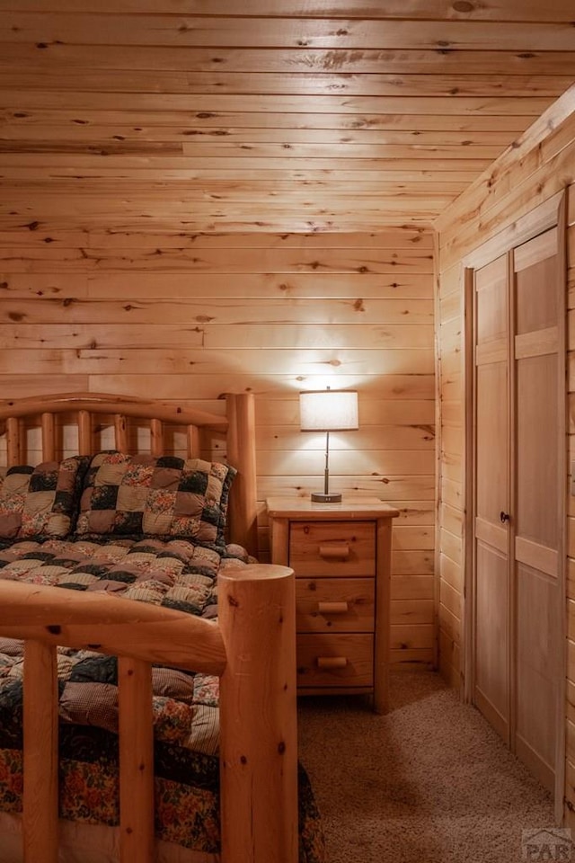 317 Parsons Rd, La Veta, CO 81055 - bedroom featuring wood ceiling, wood walls, and carpet floors