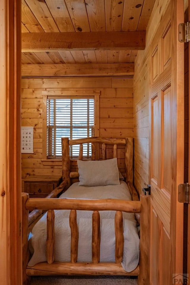 317 Parsons Rd, La Veta, CO 81055 - bedroom featuring wooden ceiling, wooden walls, and beam ceiling