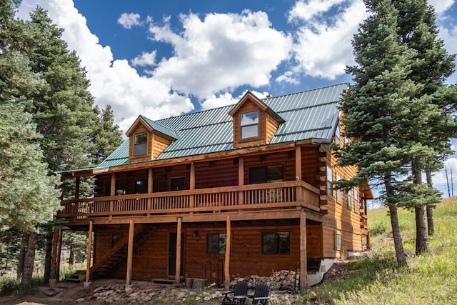 317 Parsons Rd, La Veta, CO 81055 - back of house with a deck, log siding, stairs, and metal roof