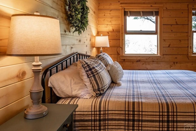 317 Parsons Rd, La Veta, CO 81055 - bedroom with wooden walls and multiple windows