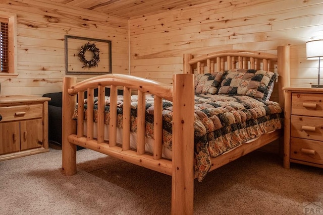 317 Parsons Rd, La Veta, CO 81055 - carpeted bedroom with wood walls and wooden ceiling
