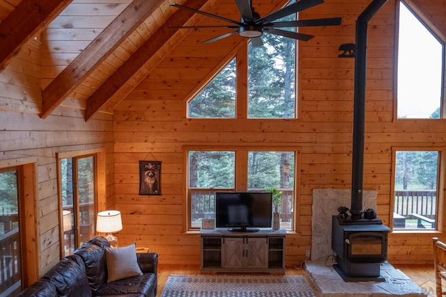 317 Parsons Rd, La Veta, CO 81055 - living room with wood walls, healthy amount of natural light, high vaulted ceiling, hardwood / wood-style floors, and beamed ceiling