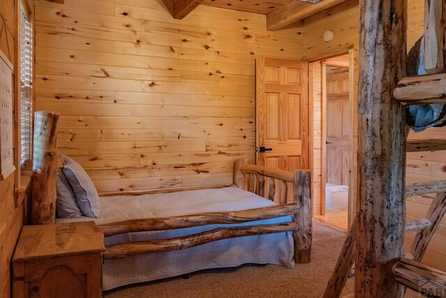 317 Parsons Rd, La Veta, CO 81055 - carpeted bedroom featuring wooden walls