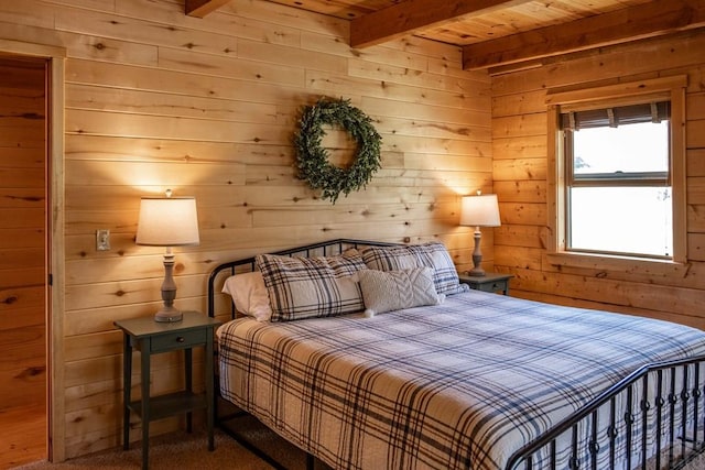 317 Parsons Rd, La Veta, CO 81055 - bedroom with beamed ceiling, wooden walls, wooden ceiling, and carpet flooring