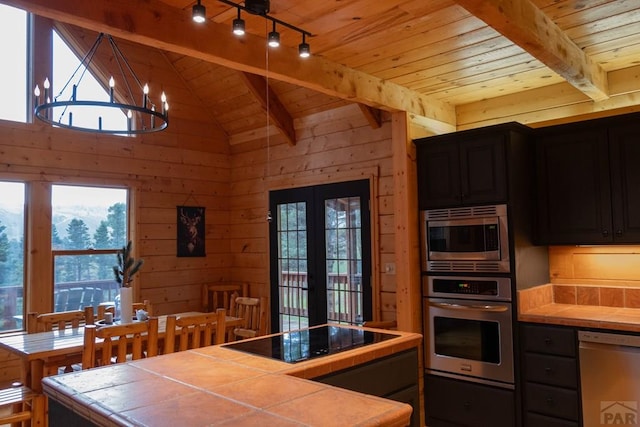 317 Parsons Rd, La Veta, CO 81055 - kitchen with appliances with stainless steel finishes, tile countertops, wood ceiling, a chandelier, and french doors