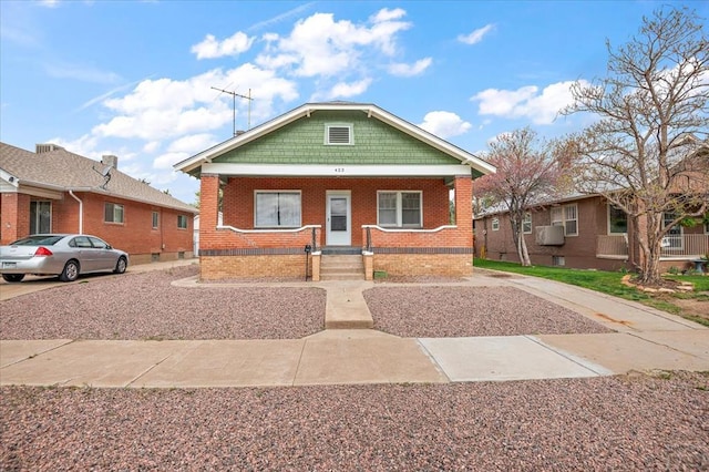 423 Washington St, Pueblo, CO 81004 - bungalow-style home featuring covered porch and brick siding