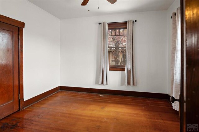 423 Washington St, Pueblo, CO 81004 - spare room with ceiling fan, hardwood / wood-style flooring, and baseboards