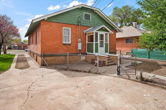 423 Washington St, Pueblo, CO 81004 - rear view of property featuring brick siding