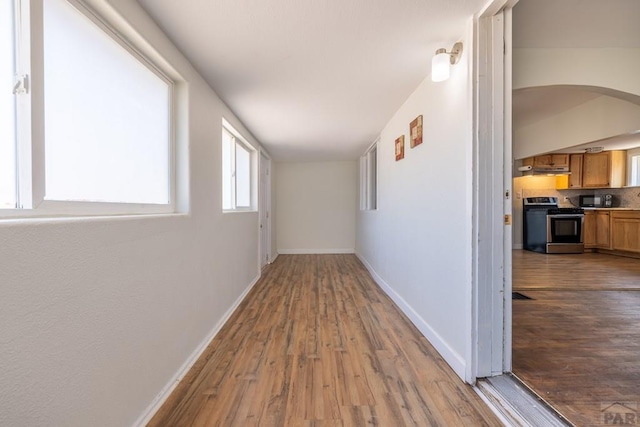 212 W Summit Ave, Pueblo, CO 81004 - corridor with wood finished floors and arched walkways