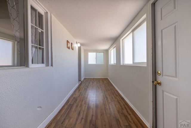 212 W Summit Ave, Pueblo, CO 81004 - hallway with baseboards and wood finished floors