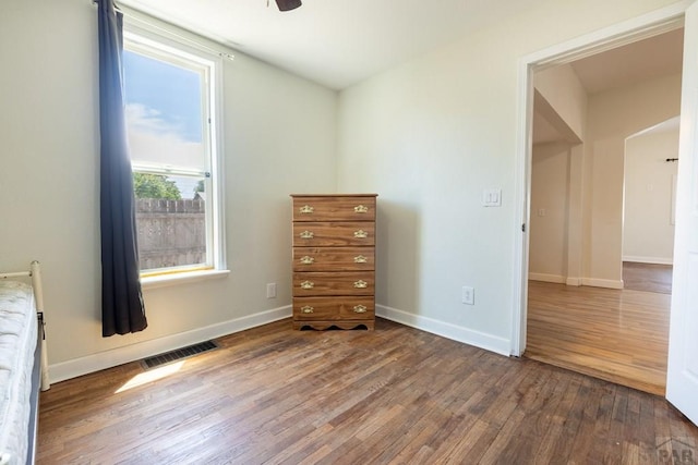 212 W Summit Ave, Pueblo, CO 81004 - unfurnished bedroom featuring wood finished floors and baseboards
