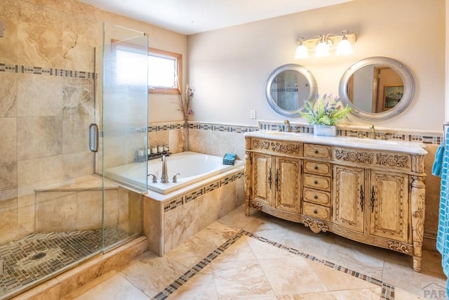 bathroom featuring double vanity, a sink, a shower stall, and a bath