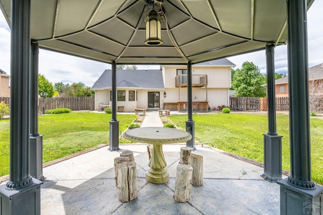 view of patio featuring a gazebo and a fenced backyard