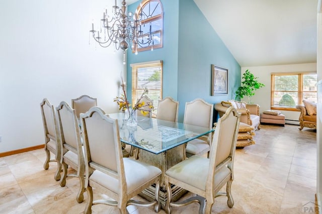 dining room featuring a chandelier, plenty of natural light, high vaulted ceiling, and baseboards