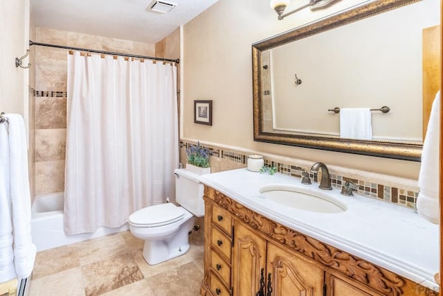 full bath with a wainscoted wall, tile walls, visible vents, toilet, and vanity