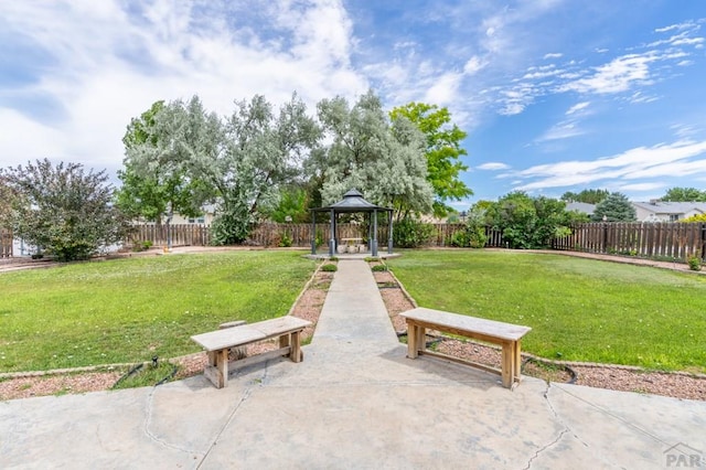 view of home's community featuring a fenced backyard, a lawn, a gazebo, and a patio