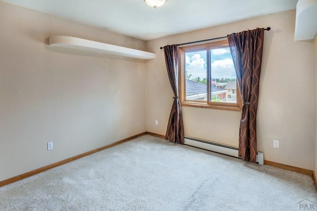 spare room with baseboards, a baseboard radiator, and light colored carpet