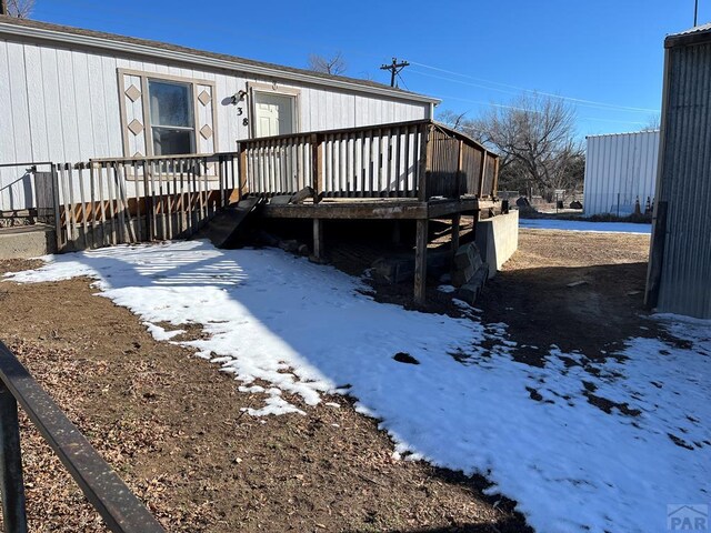 view of snow covered deck