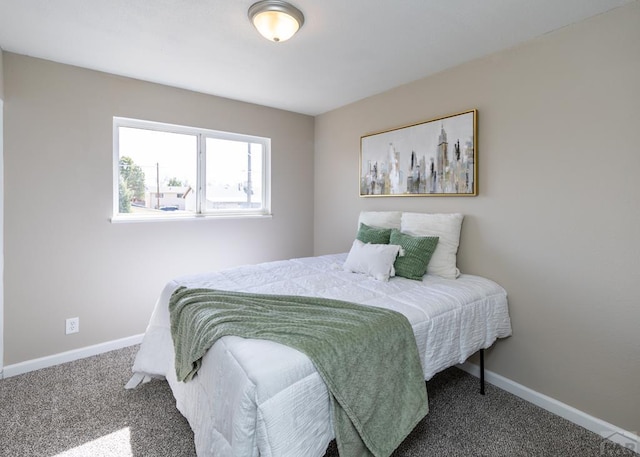 carpeted bedroom featuring baseboards