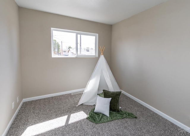 game room with carpet floors and baseboards