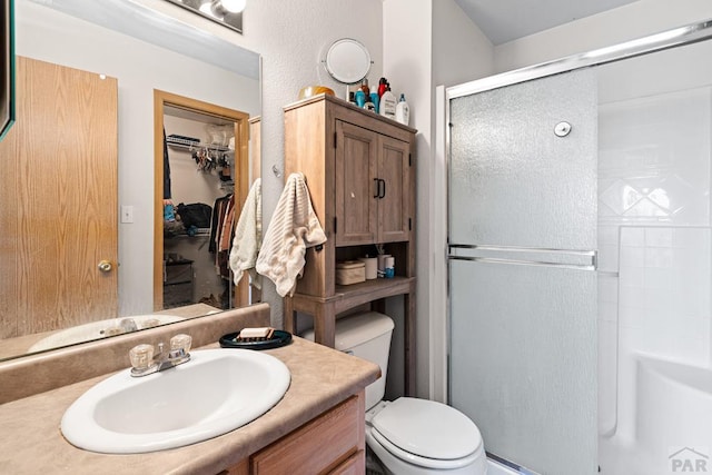 1224 Silver Hawk Ct, Pueblo, CO 81008 - full bathroom with a shower with shower door, vanity, and a spacious closet