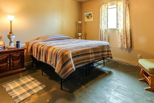 bedroom with concrete flooring