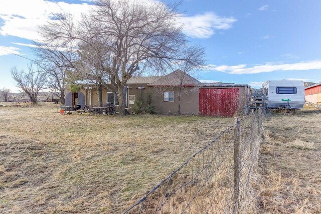 exterior space with a yard and fence