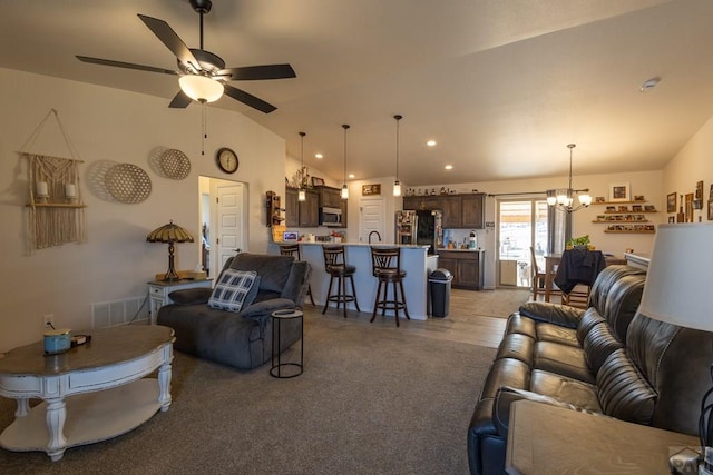 1379 N Dailey Dr, Pueblo West, CO 81007 - living area featuring recessed lighting, vaulted ceiling, visible vents, and ceiling fan with notable chandelier