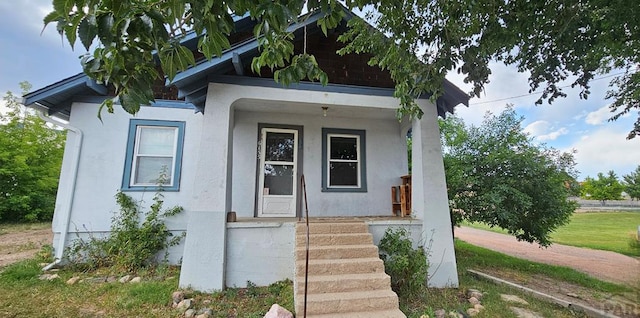 exterior space featuring stucco siding