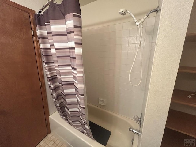 15840 Teak Pl, Elbert, CO 80106 - bathroom with tile patterned floors and shower / tub combo