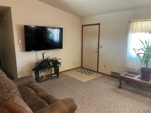 carpeted living room with a textured ceiling, baseboards, lofted ceiling, and tile patterned floors