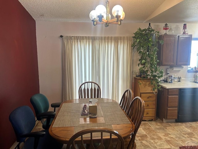 15840 Teak Pl, Elbert, CO 80106 - dining area with a textured ceiling and a chandelier