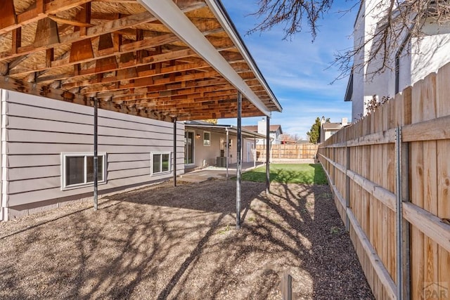 exterior space with fence and central air condition unit