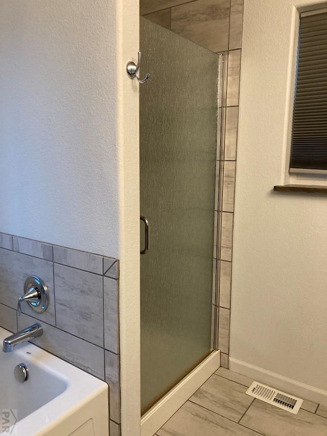 47 S Jibbsam Way, Pueblo West, CO 81007 - bathroom featuring a shower stall and a bath