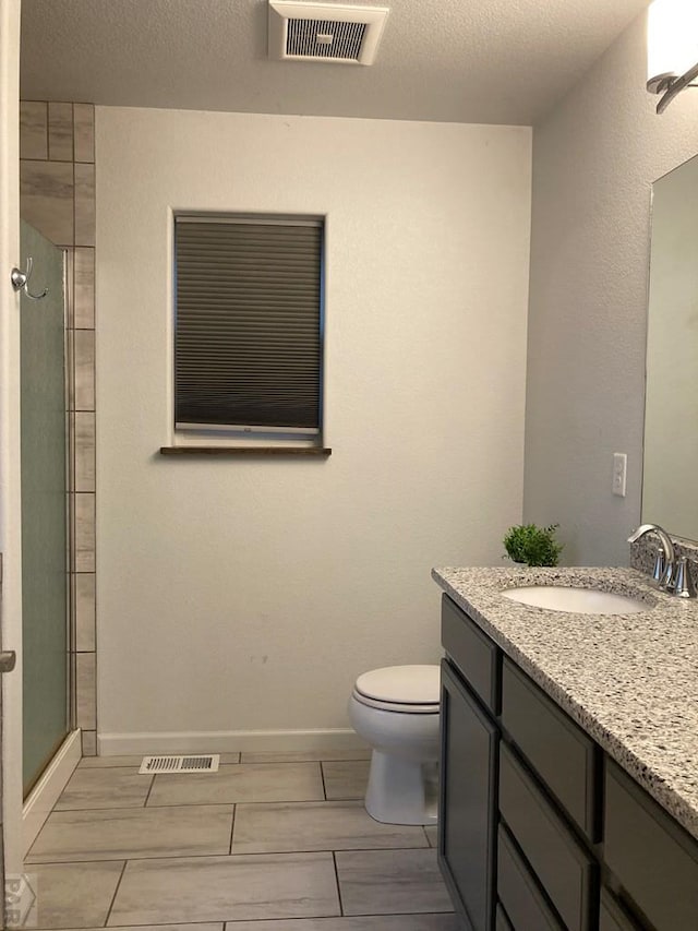 47 S Jibbsam Way, Pueblo West, CO 81007 - full bathroom with vanity, a shower stall, and a textured ceiling