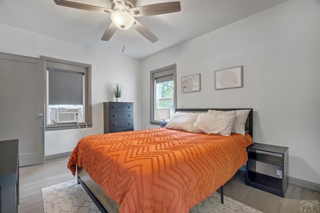 411 Olive St, Colorado Springs, CO 80904 - bedroom with light wood-style flooring, baseboards, and a ceiling fan