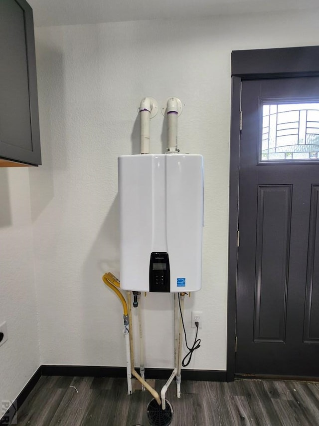 utility room with tankless water heater