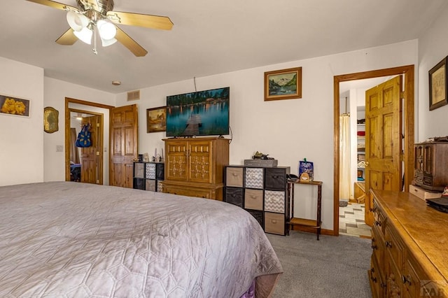 bedroom with visible vents, carpet flooring, and ceiling fan