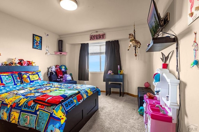 carpeted bedroom with baseboards